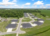 Thumbnail 13 of 43 - an aerial view of a neighborhood of houses with cars parked at Morada at Maysville, Indiana