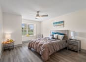 Thumbnail 9 of 43 - a bedroom with a bed and a ceiling fan at Morada at Maysville, Fort Wayne, IN