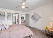 Thumbnail 23 of 43 - a bedroom with a large bed and a ceiling fan at Morada at Maysville, Fort Wayne, IN