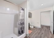 Thumbnail 34 of 43 - a bathroom with a shower and a toilet and a sink at Morada at Maysville, Indiana