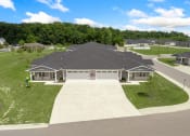Thumbnail 39 of 43 - a house with a driveway in front of a grass yard at Morada at Maysville, Fort Wayne Indiana