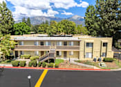 Thumbnail 6 of 40 - A building with a mountain in the background.