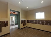Thumbnail 20 of 50 - A hallway with a wall of lockers on the right side.