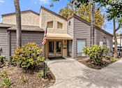 Thumbnail 2 of 30 - A house with a flag on the front.