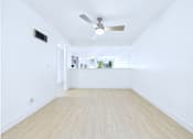Thumbnail 45 of 49 - A room with a ceiling fan and light switch.