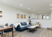 Thumbnail 25 of 29 - Living room with wood-inspired floors throughout, recessed lighting
