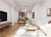 Thumbnail 6 of 53 - A living room with a white couch and a wooden coffee table.