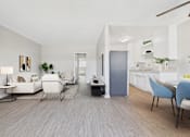 Thumbnail 40 of 49 - A living room with a grey floor and white walls.