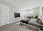 Thumbnail 43 of 49 - A bedroom with a large bed and a flat screen TV mounted on the wall.