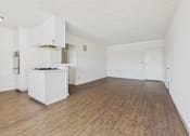 Thumbnail 23 of 33 - A kitchen with a white cabinet and a white fridge.