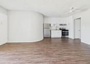 Thumbnail 25 of 75 - A kitchen with white cabinets and a stainless steel refrigerator.