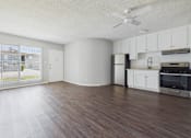 Thumbnail 27 of 75 - A kitchen with white cabinets and a refrigerator.