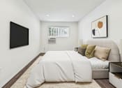 Thumbnail 25 of 95 - A bedroom with a large bed and a flat screen TV mounted on the wall.