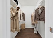Thumbnail 10 of 81 - A hallway with a coat rack and a basket on the floor.