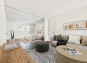 Thumbnail 7 of 81 - A living room with a grey couch and a green ottoman.