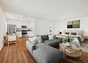 Thumbnail 16 of 81 - A modern living room with a grey couch and a wooden coffee table.