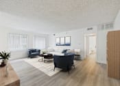 Thumbnail 4 of 16 - A living room with a blue sofa and a wooden floor.