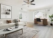 Thumbnail 4 of 29 - A living room with a white couch, a coffee table, and a ceiling fan.