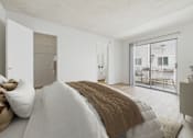Thumbnail 9 of 29 - A bedroom with a large bed and a view of a balcony.