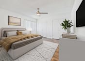 Thumbnail 9 of 90 - A bedroom with a large bed and a ceiling fan.