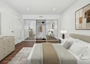 Thumbnail 23 of 95 - A bedroom with a large bed and a wardrobe in the background.