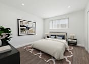 Thumbnail 6 of 91 - A bedroom with a large bed and a painting on the wall.