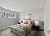 Thumbnail 2 of 50 - A bedroom with a bed, nightstands, and a painting on the wall.