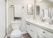 Thumbnail 26 of 50 - a white bathroom with a toilet and a sink