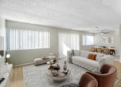 Thumbnail 10 of 50 - a living room with a couch and a table