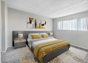 Thumbnail 12 of 50 - a bedroom with a bed and a window
