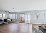Thumbnail 2 of 60 - A living room with a dining table and chairs.