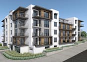 Thumbnail 17 of 18 - A modern apartment building with balconies and windows.
