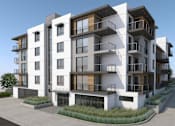 Thumbnail 18 of 18 - A modern apartment building with balconies and windows.