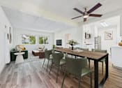 Thumbnail 3 of 36 - A dining room with a table and chairs.