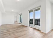 Thumbnail 140 of 163 - A room with a wooden floor and white walls.
