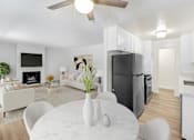 Thumbnail 1 of 44 - A modern kitchen with a white table and chairs.