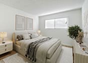 Thumbnail 8 of 44 - A bedroom with a large bed and a nightstand with a lamp.