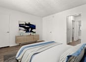 Thumbnail 17 of 44 - a bedroom with a bed and a mirror and a closet