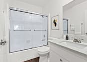 Thumbnail 18 of 44 - a bathroom with a sink toilet and a shower