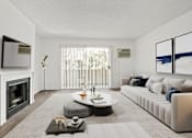Thumbnail 15 of 44 - a living room with a white couch and a fireplace