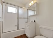 Thumbnail 11 of 24 - a bathroom with a shower and a toilet and a sink
