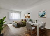 Thumbnail 5 of 24 - an open living room and dining room with a bed and a table and chairs