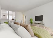 Thumbnail 13 of 24 - a bedroom with a large bed and a tv