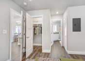 Thumbnail 5 of 10 - a bedroom with a closet and a door to a bathroom