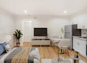 Thumbnail 20 of 45 - A modern bedroom with a bed, a chair, a table, and a television.