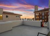 Thumbnail 19 of 66 - the view of the sunset from the balcony of a house with a roof