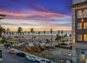 Thumbnail 9 of 66 - a view of the beach from a building at sunset