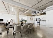 Thumbnail 5 of 123 - A modern dining room with a long table and chairs.