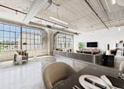 Thumbnail 4 of 123 - A modern living room with a large window and a grey couch.