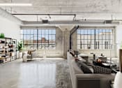 Thumbnail 3 of 123 - A modern living room with a concrete floor and a large window.